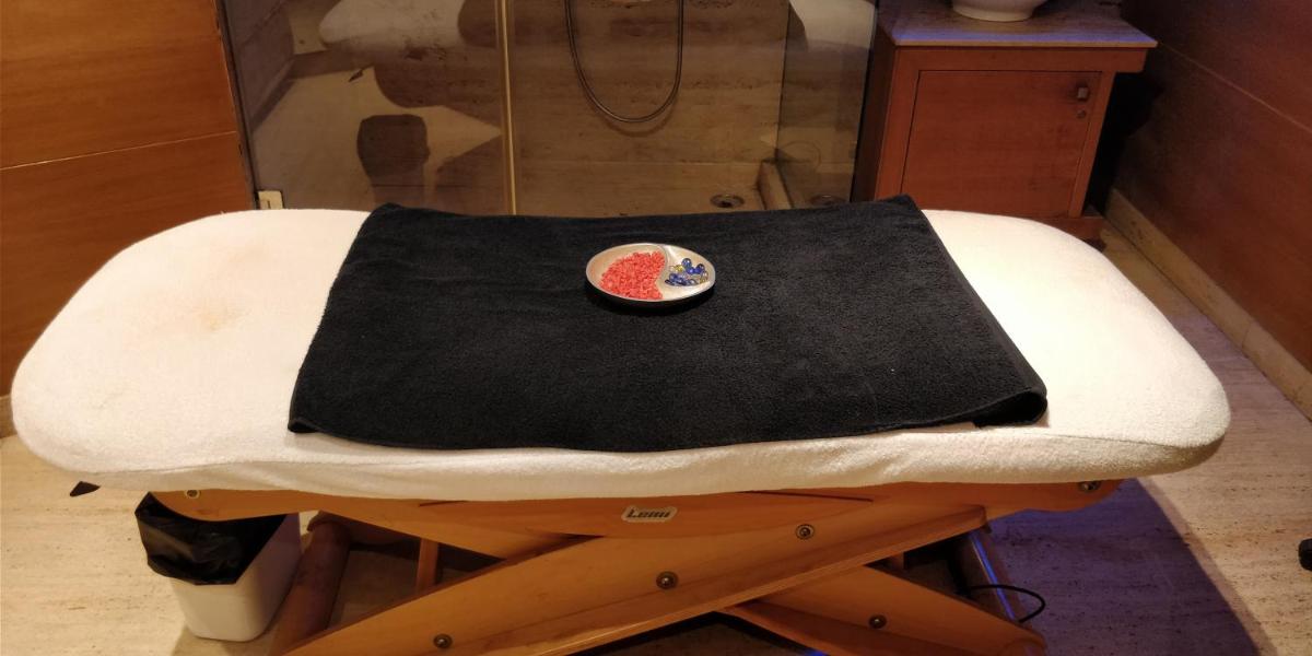 a chair with a black blanket on top of it at Jaypee Vasant Continental in New Delhi