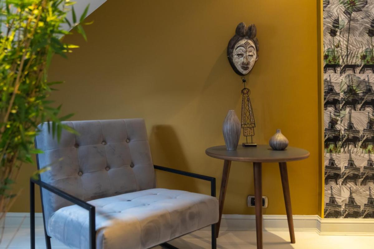 Coin salon dans l'établissement Résidence & Spa Le Prince Régent
