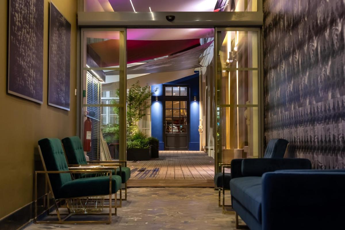 Coin salon dans l'établissement Résidence & Spa Le Prince Régent
