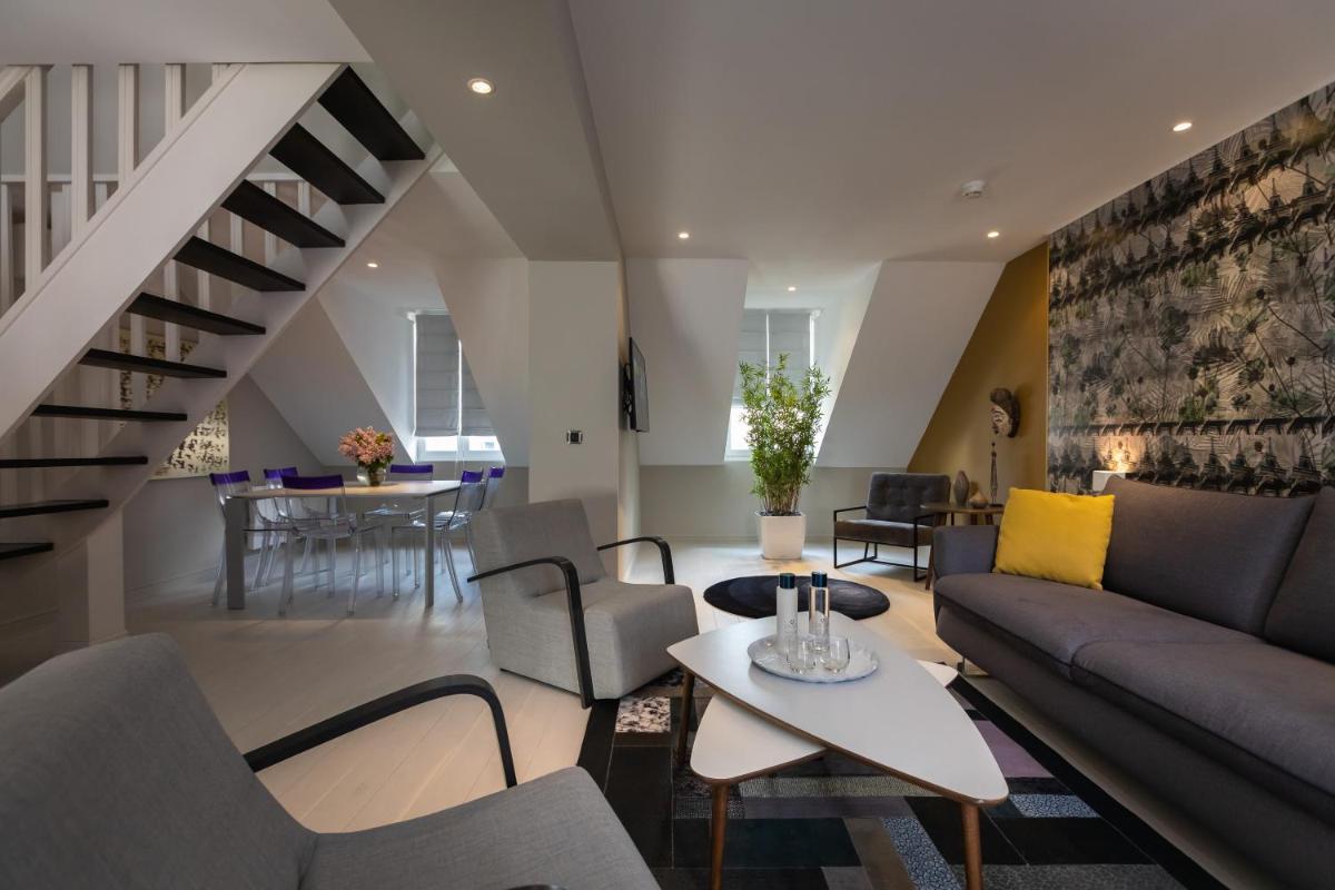 Coin salon dans l'établissement Résidence & Spa Le Prince Régent