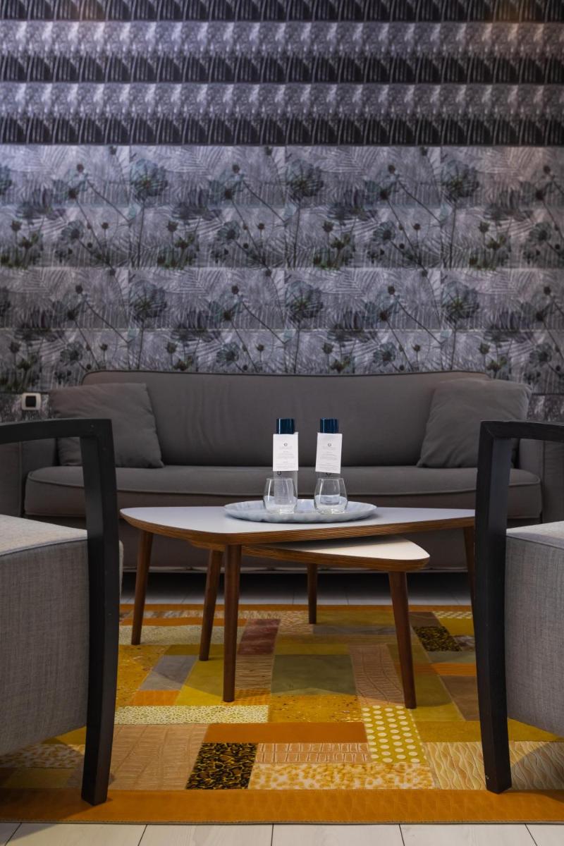 Coin salon dans l'établissement Résidence & Spa Le Prince Régent