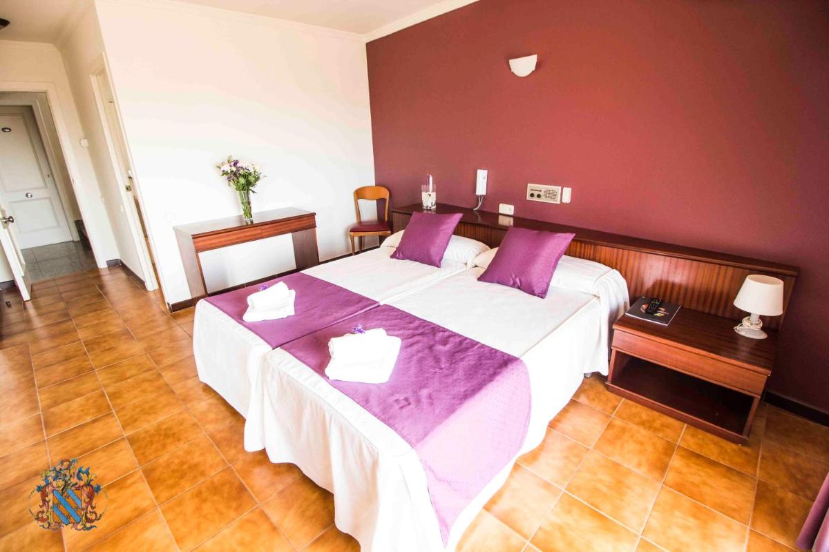 Cama o camas de una habitación en Hotel Victoria Spa & Splay Center