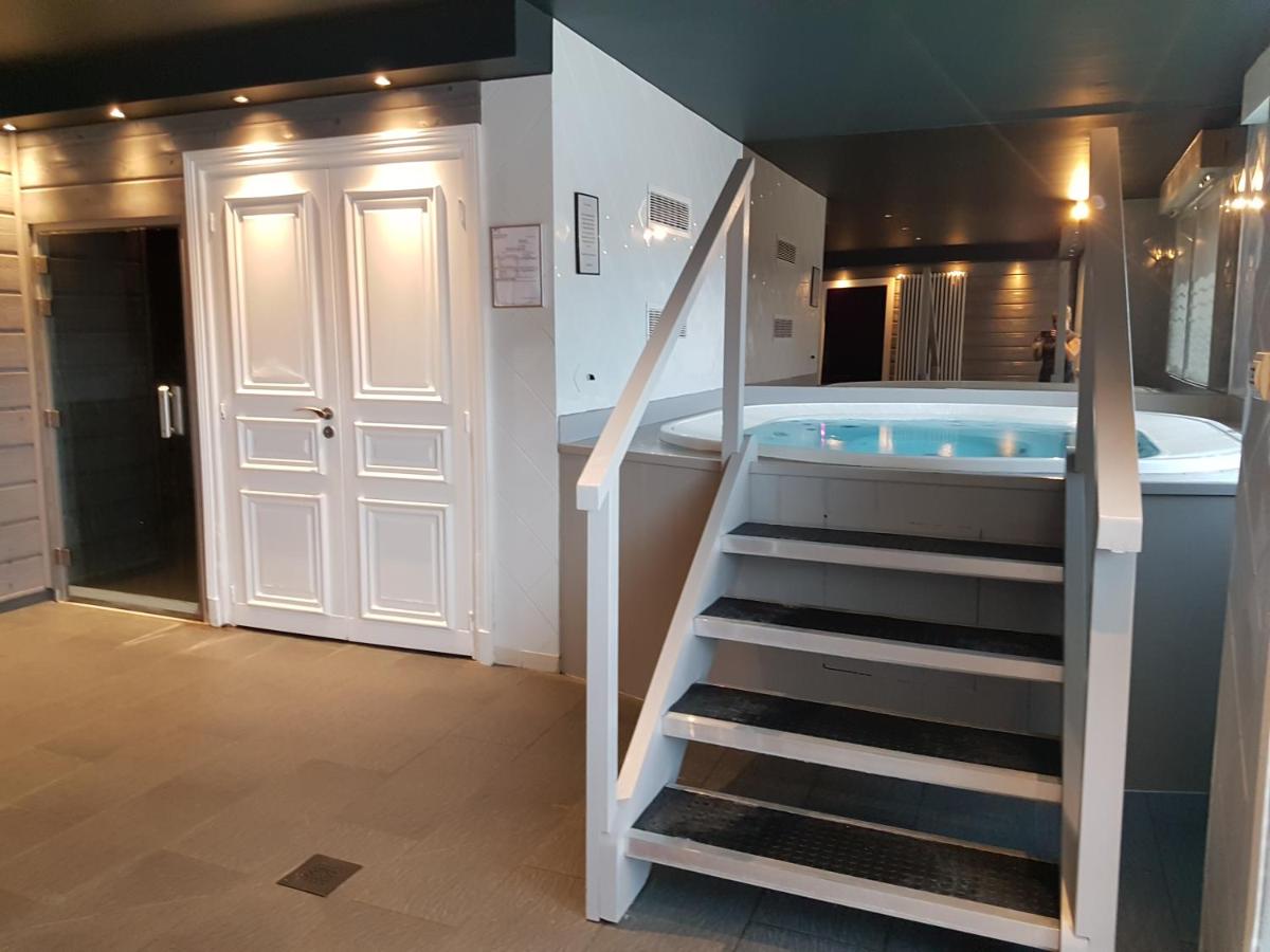 Un ou plusieurs lits dans un hébergement de l'établissement Hôtel Beau Rivage