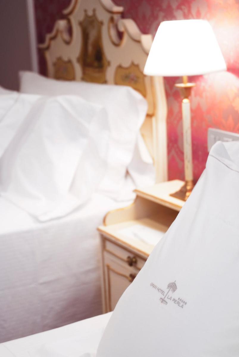 Cama o camas de una habitación en Gran Hotel La Perla