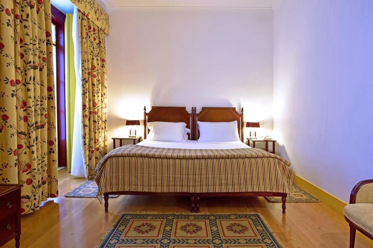 Uma cama ou camas num quarto em Central Monchique Hotel - Villa Termal Spa Resort - by Unlock Hotels
