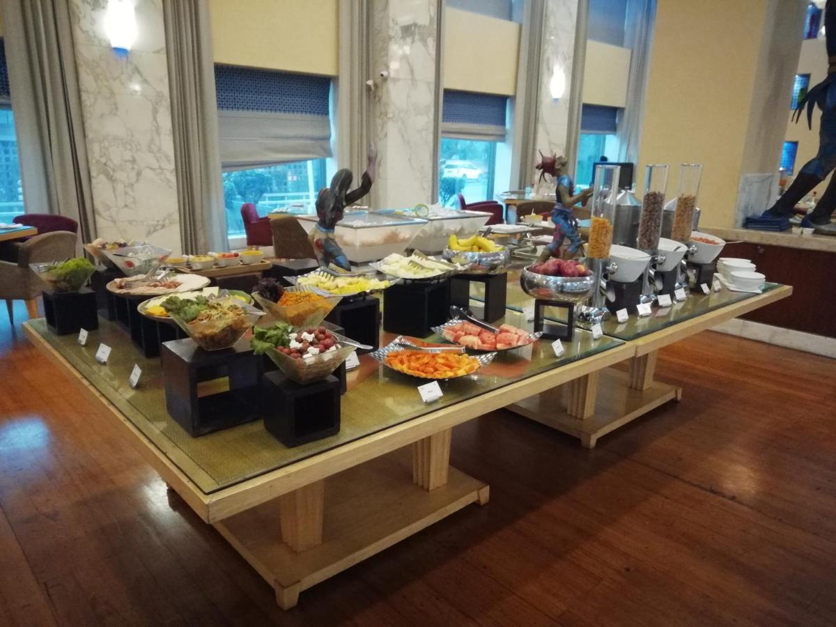 a buffet of food on a table in a room at Jaypee Vasant Continental in New Delhi