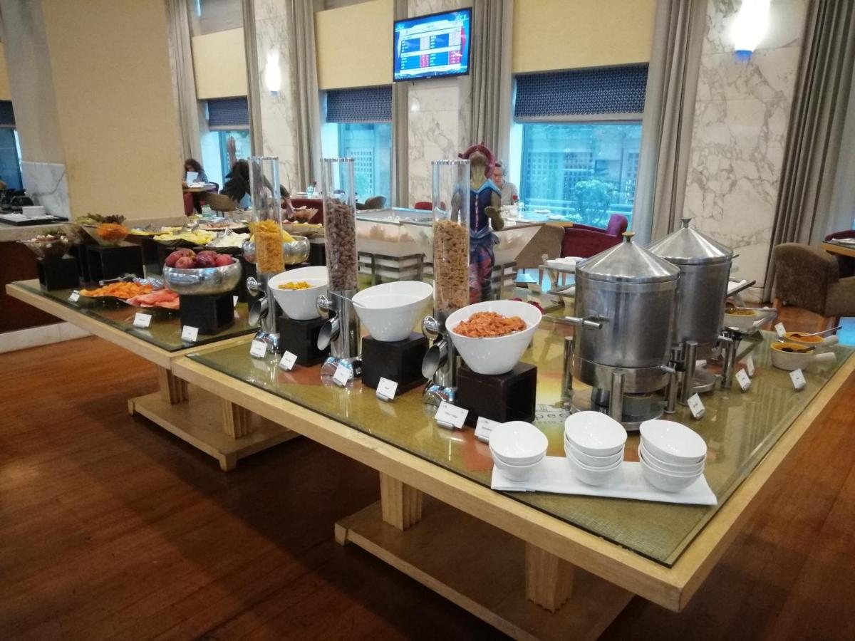 a buffet of food on a table in a hotel at Jaypee Vasant Continental in New Delhi