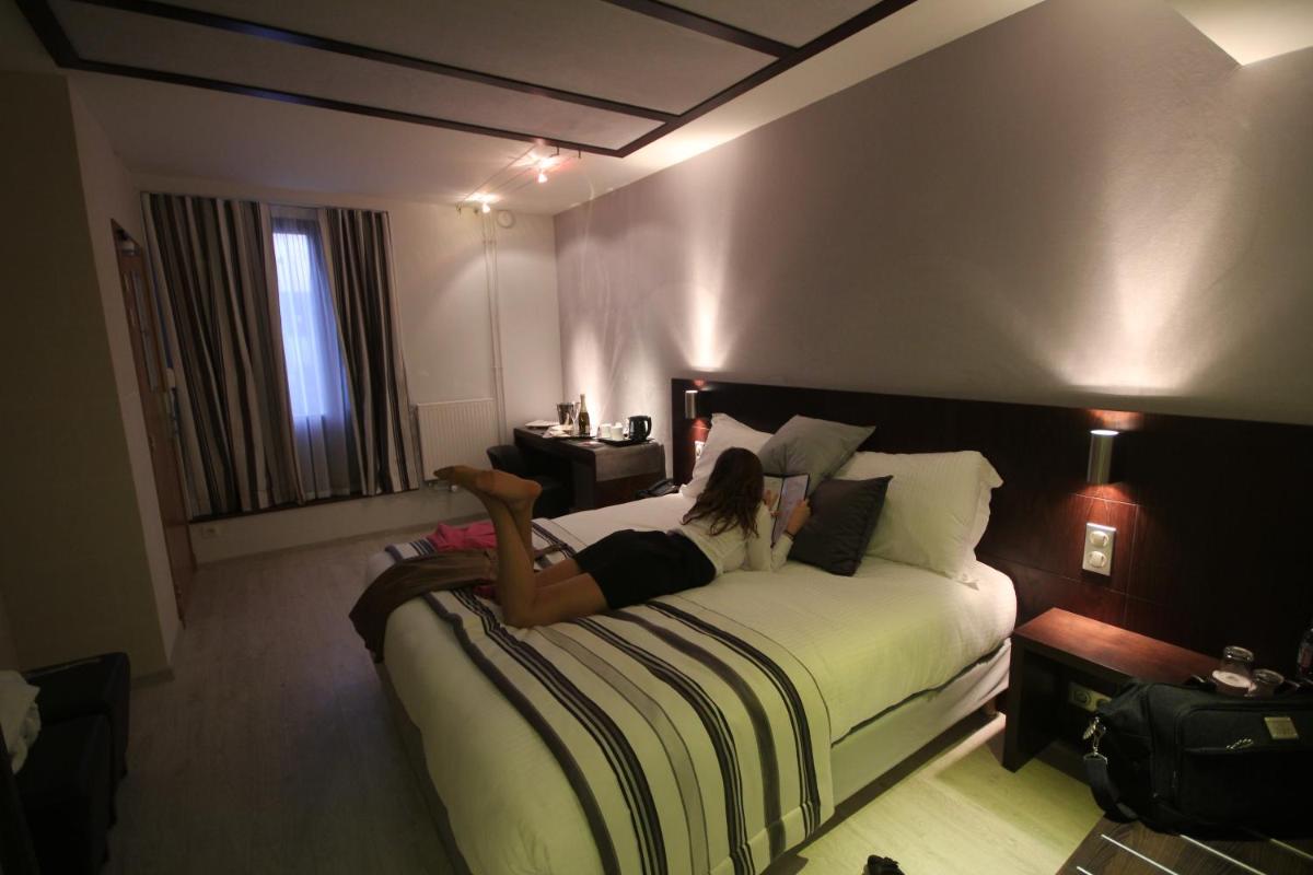 Un ou plusieurs lits dans un hébergement de l'établissement Best Western Plus Hotel des Francs