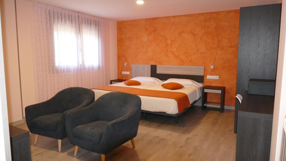Cama o camas de una habitación en Hotel Rural El Nido de Pinares
