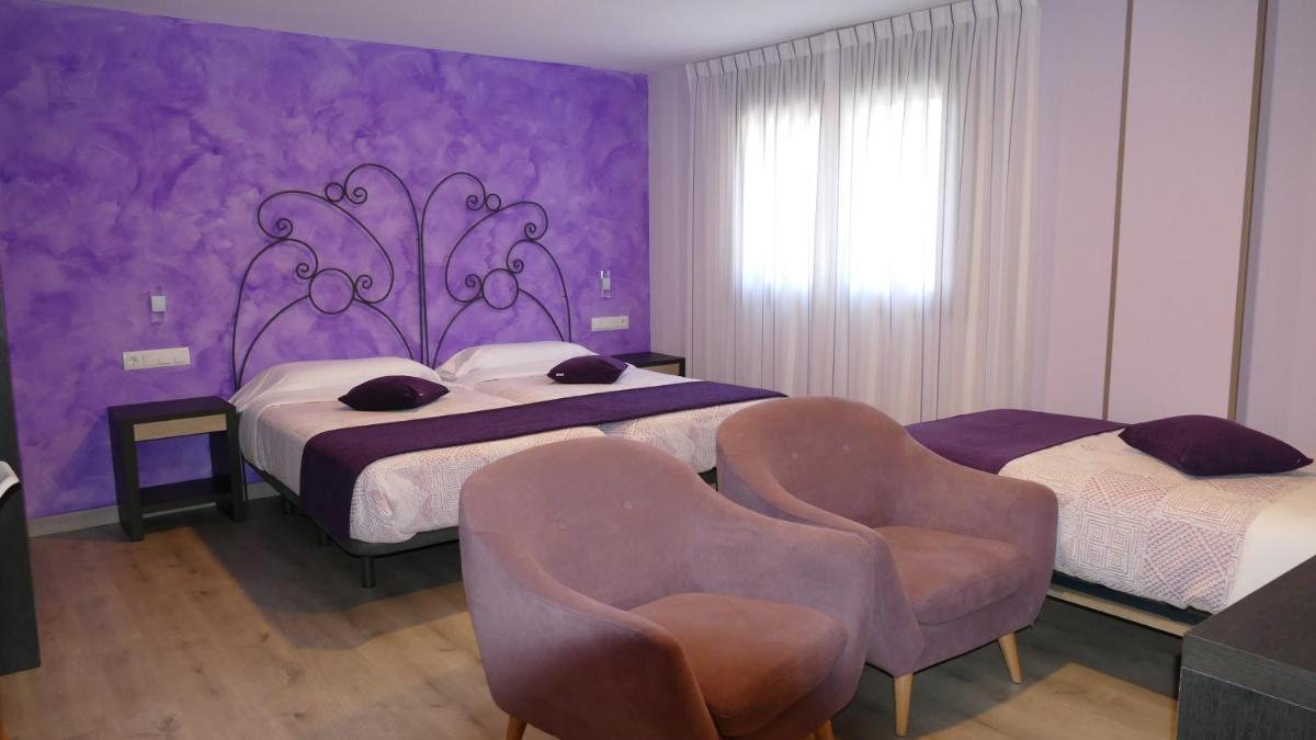 Cama o camas de una habitación en Hotel Rural El Nido de Pinares