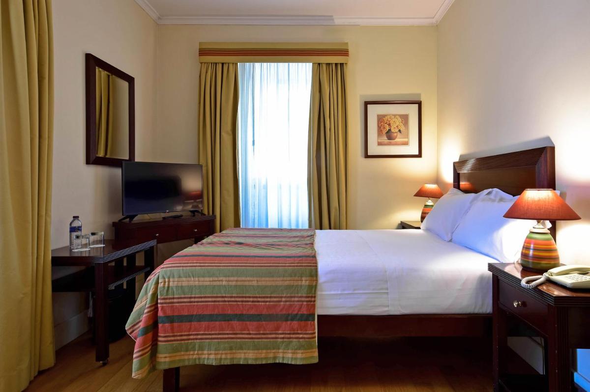 Uma cama ou camas num quarto em Central Monchique Hotel - Villa Termal Spa Resort - by Unlock Hotels
