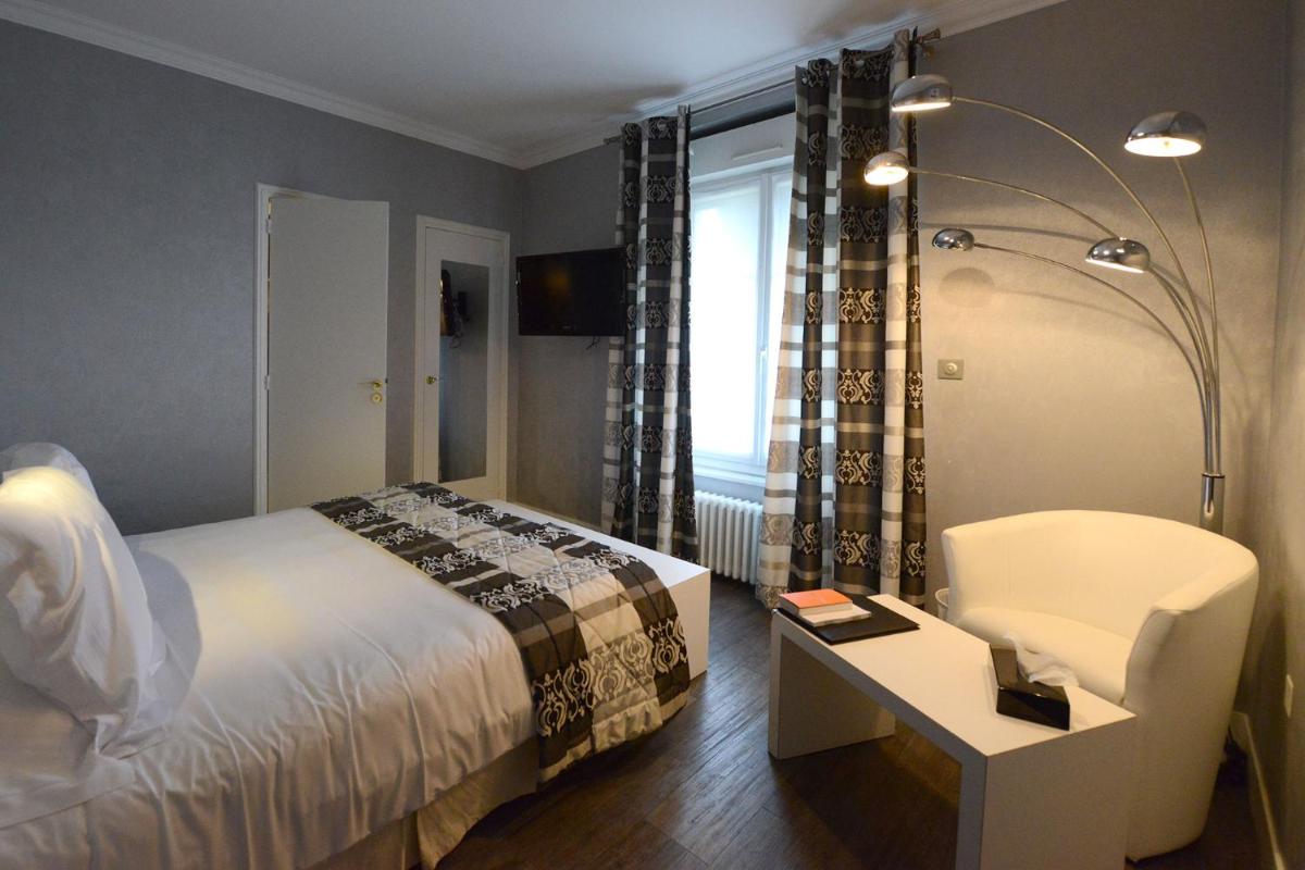 Un ou plusieurs lits dans un hébergement de l'établissement Hostellerie de la Renaissance
