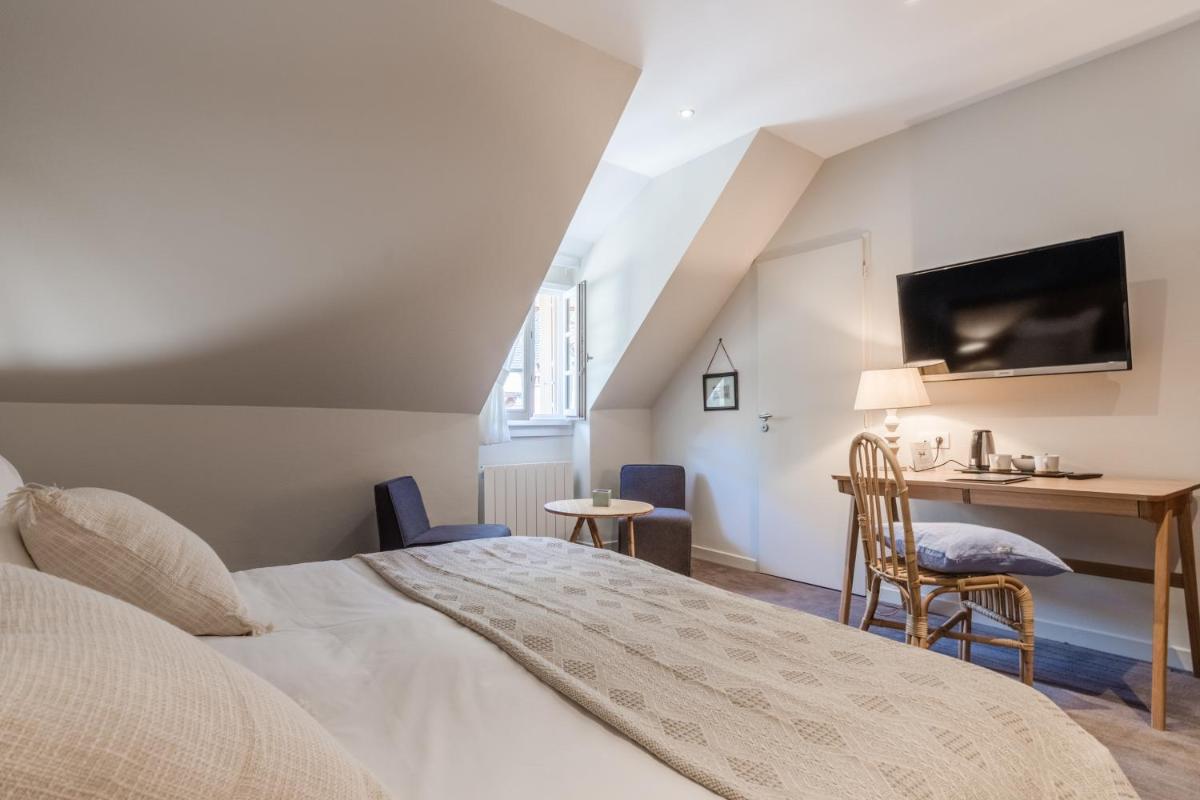 Un ou plusieurs lits dans un hébergement de l'établissement Hôtel Beau Site Talloires B SPA