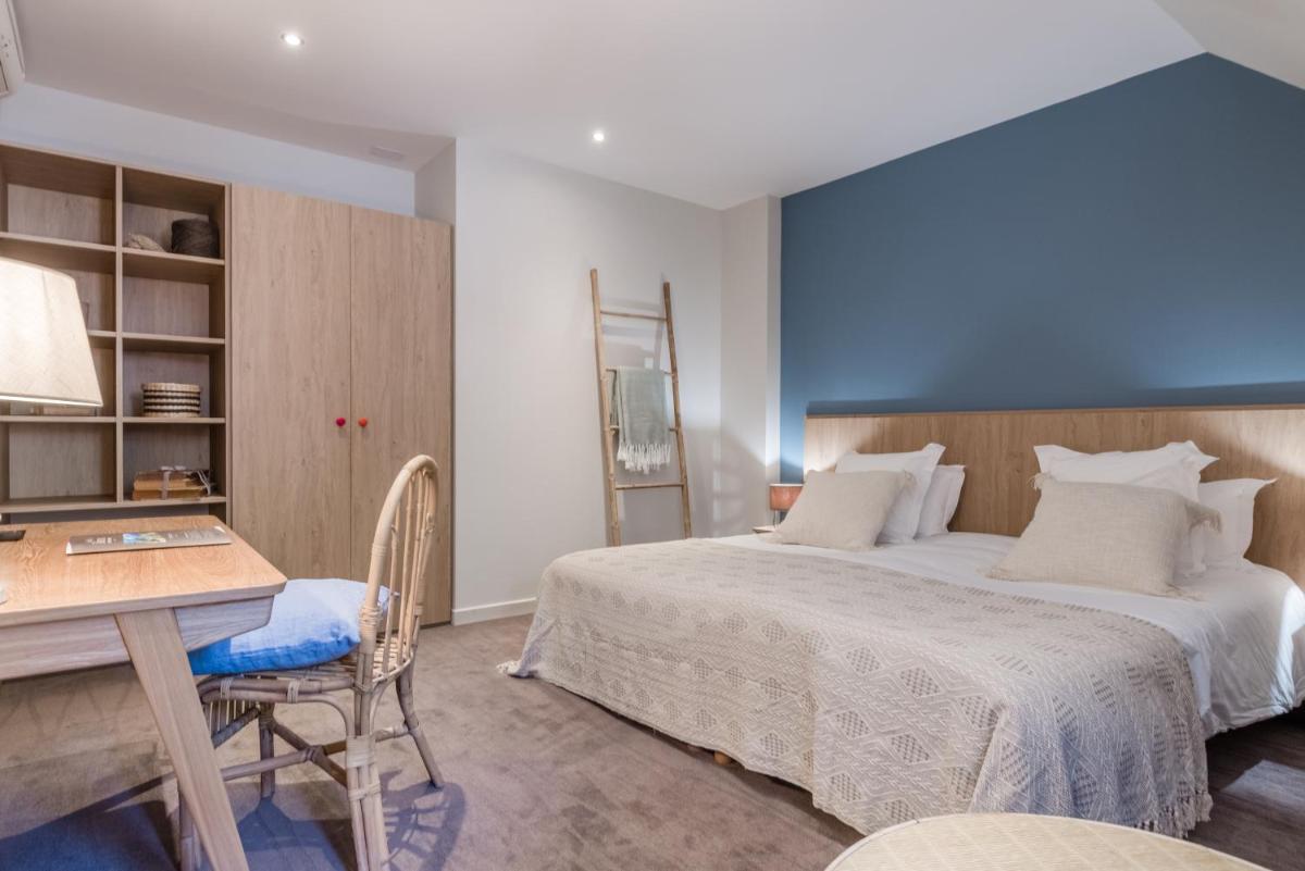 Un ou plusieurs lits dans un hébergement de l'établissement Hôtel Beau Site Talloires B SPA