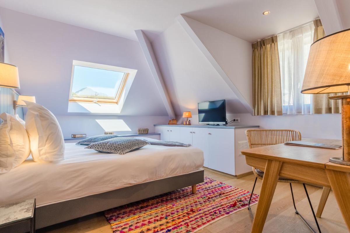 Un ou plusieurs lits dans un hébergement de l'établissement Hôtel Beau Site Talloires B SPA