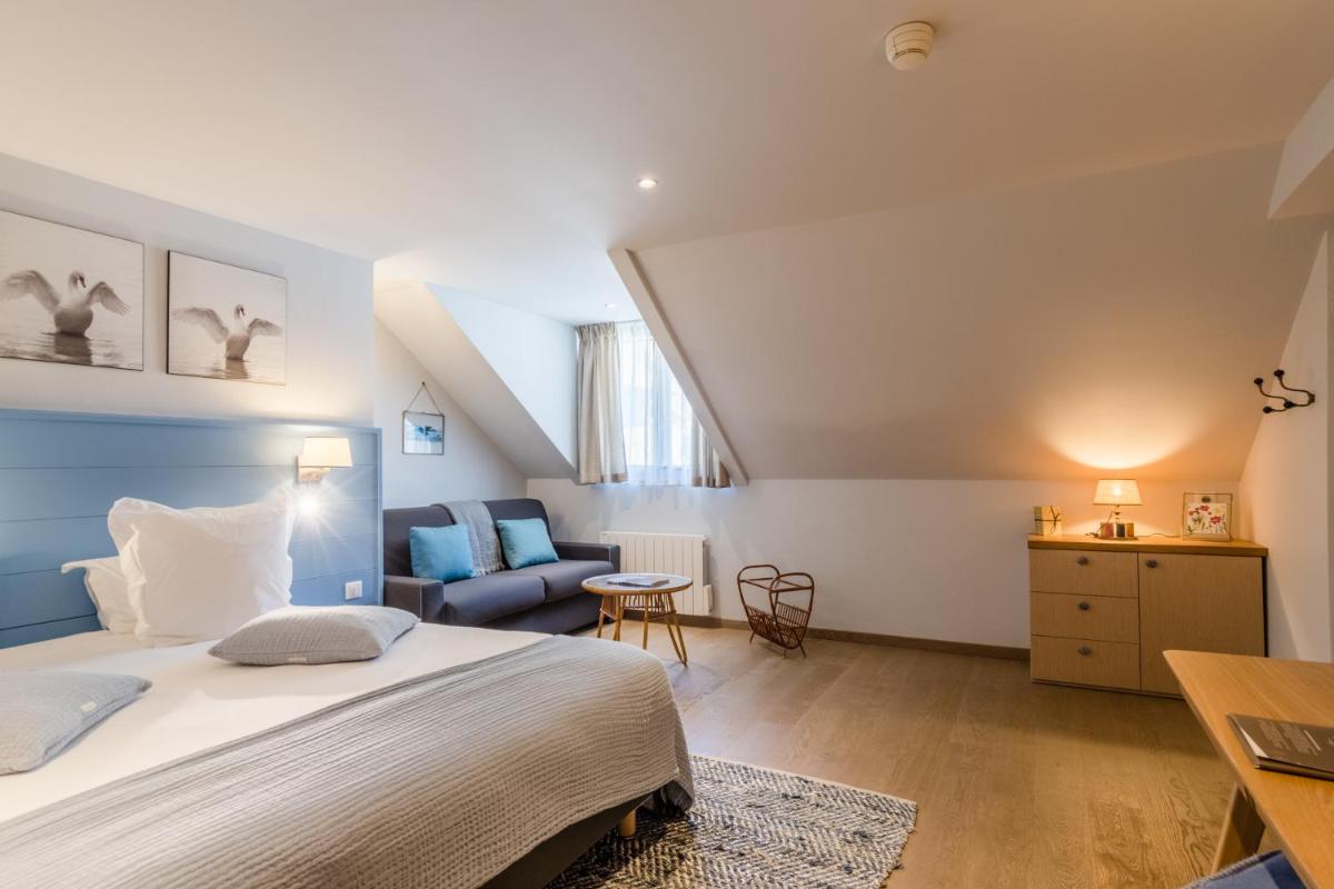 Un ou plusieurs lits dans un hébergement de l'établissement Hôtel Beau Site Talloires B SPA