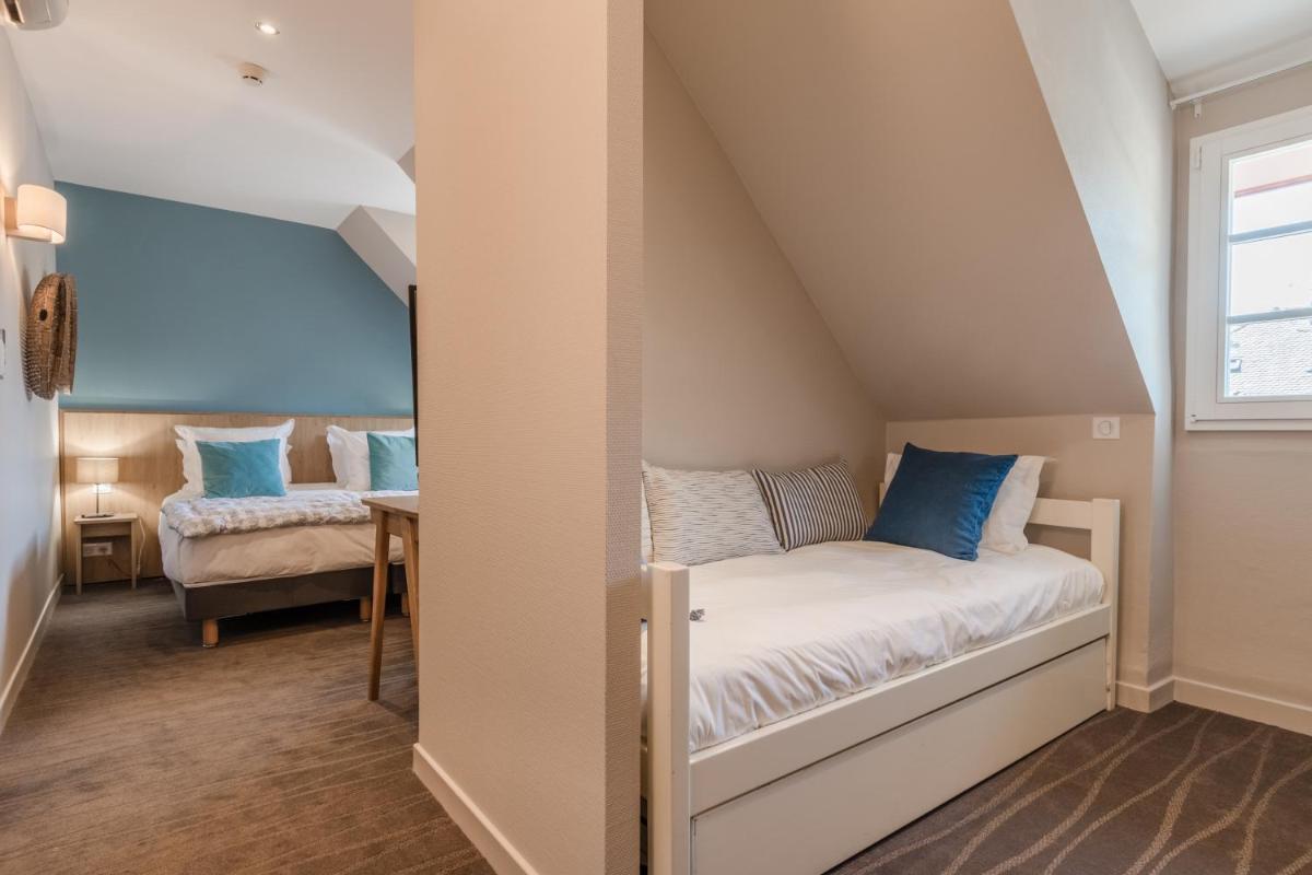 Un ou plusieurs lits dans un hébergement de l'établissement Hôtel Beau Site Talloires B SPA