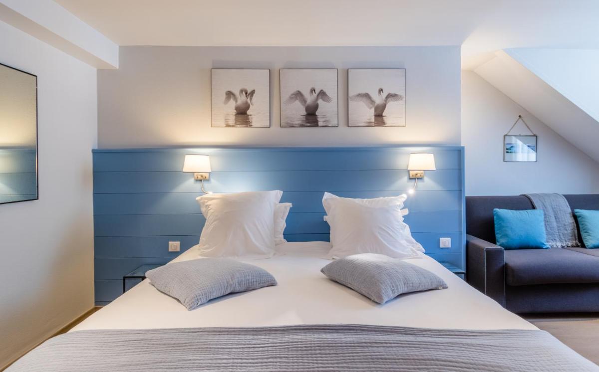 Un ou plusieurs lits dans un hébergement de l'établissement Hôtel Beau Site Talloires B SPA