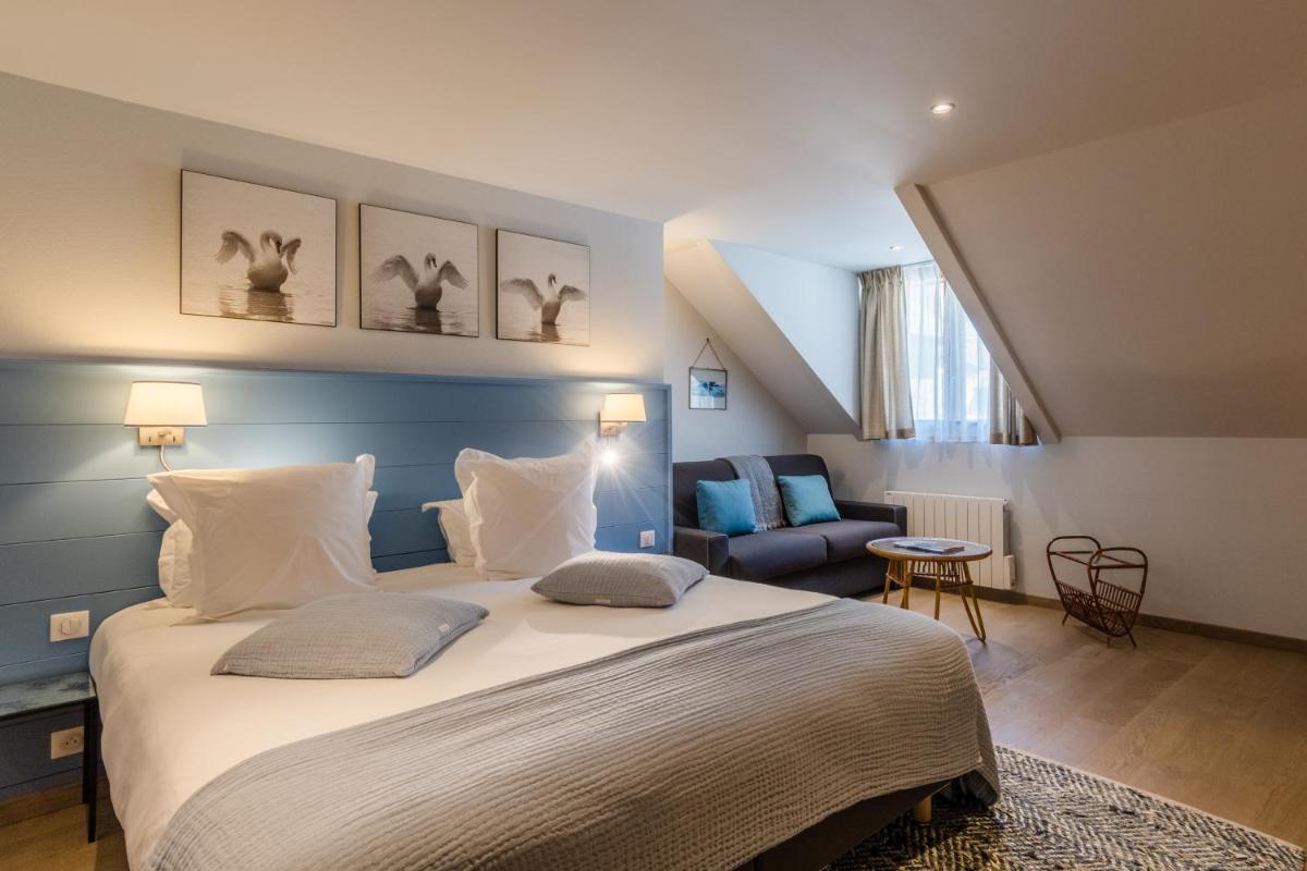 Un ou plusieurs lits dans un hébergement de l'établissement Hôtel Beau Site Talloires B SPA