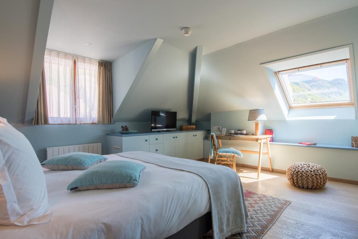 Un ou plusieurs lits dans un hébergement de l'établissement Hôtel Beau Site Talloires B SPA