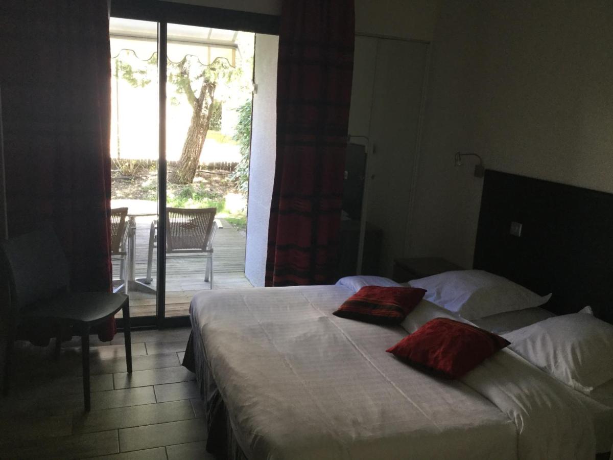 Un ou plusieurs lits dans un hébergement de l'établissement Hotel Le Phoebus Garden & Spa