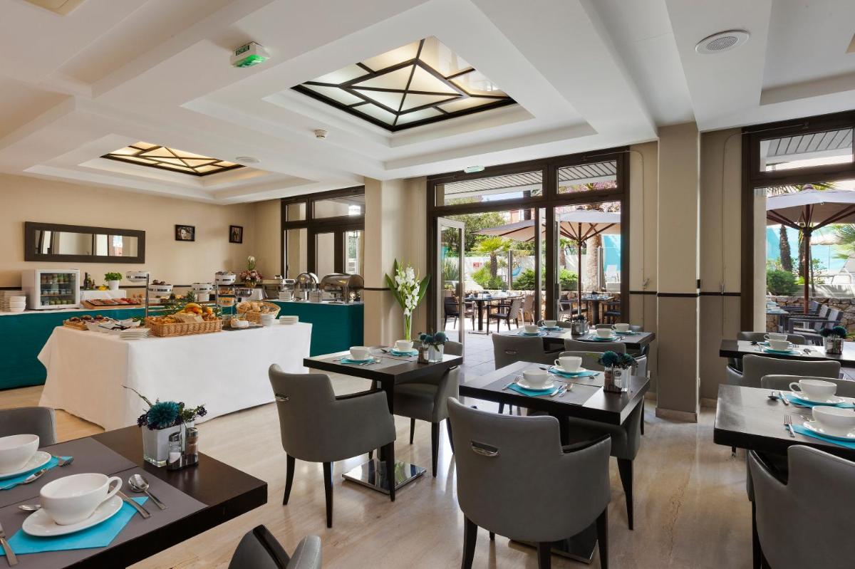 Restaurant ou autre lieu de restauration dans l'établissement Nehô Suites Cannes Croisette