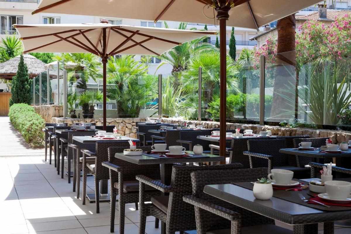 Restaurant ou autre lieu de restauration dans l'établissement Nehô Suites Cannes Croisette