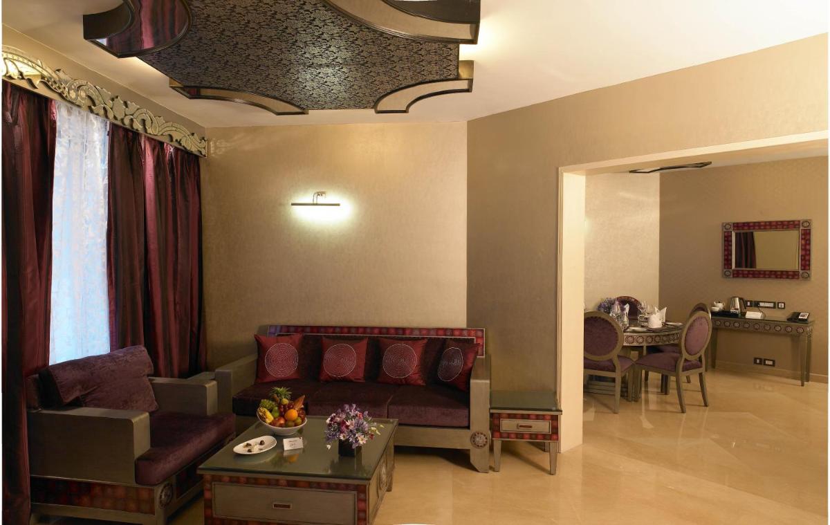 a living room with a couch and a table at The Zuri Whitefield Bengaluru in Bengaluru