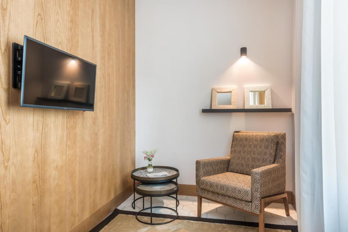 Una televisión o centro de entretenimiento en Boutique Hotel Sant Roc & Spa