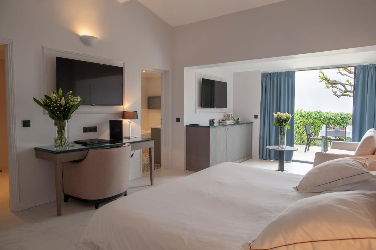 Un ou plusieurs lits dans un hébergement de l'établissement Hotel Les Bories & Spa