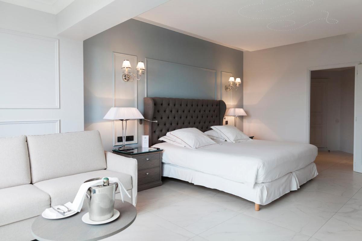 Un ou plusieurs lits dans un hébergement de l'établissement Hotel Les Bories & Spa