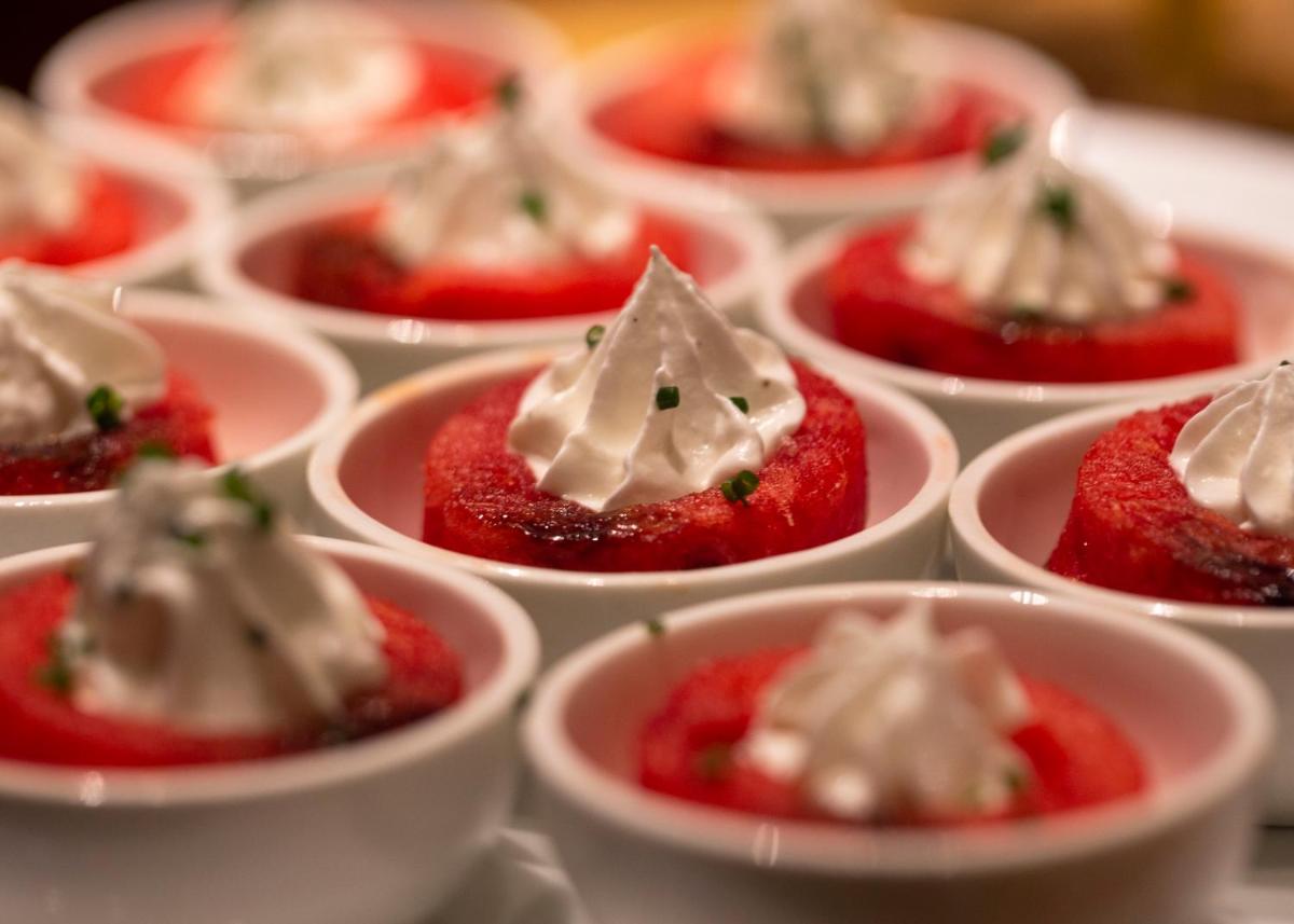 a group of mini strawberries with cream in small dishes at President - IHCL SeleQtions in Mumbai