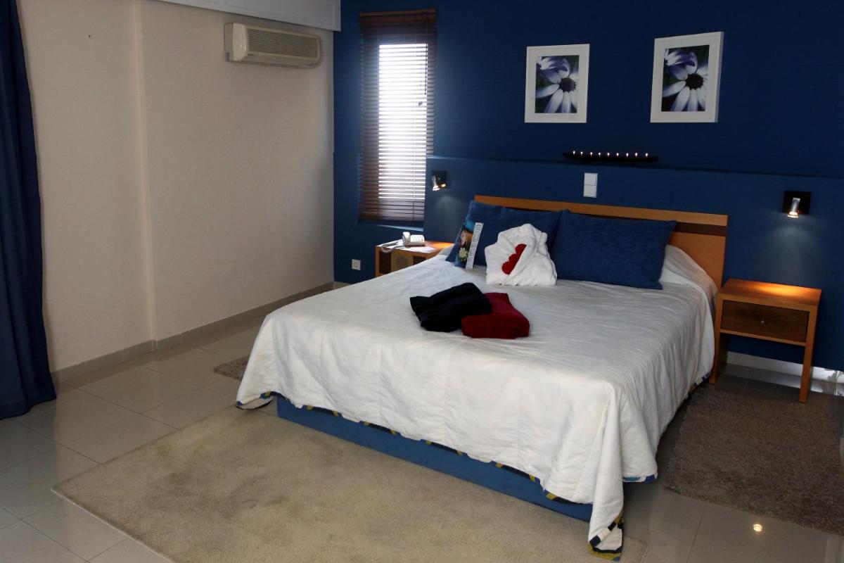 Uma cama ou camas num quarto em Rocamar Exclusive Hotel & Spa - Adults Only