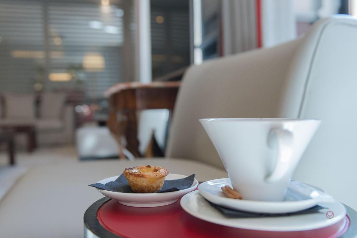 Uma área de estar em Your Hotel & Spa Alcobaça