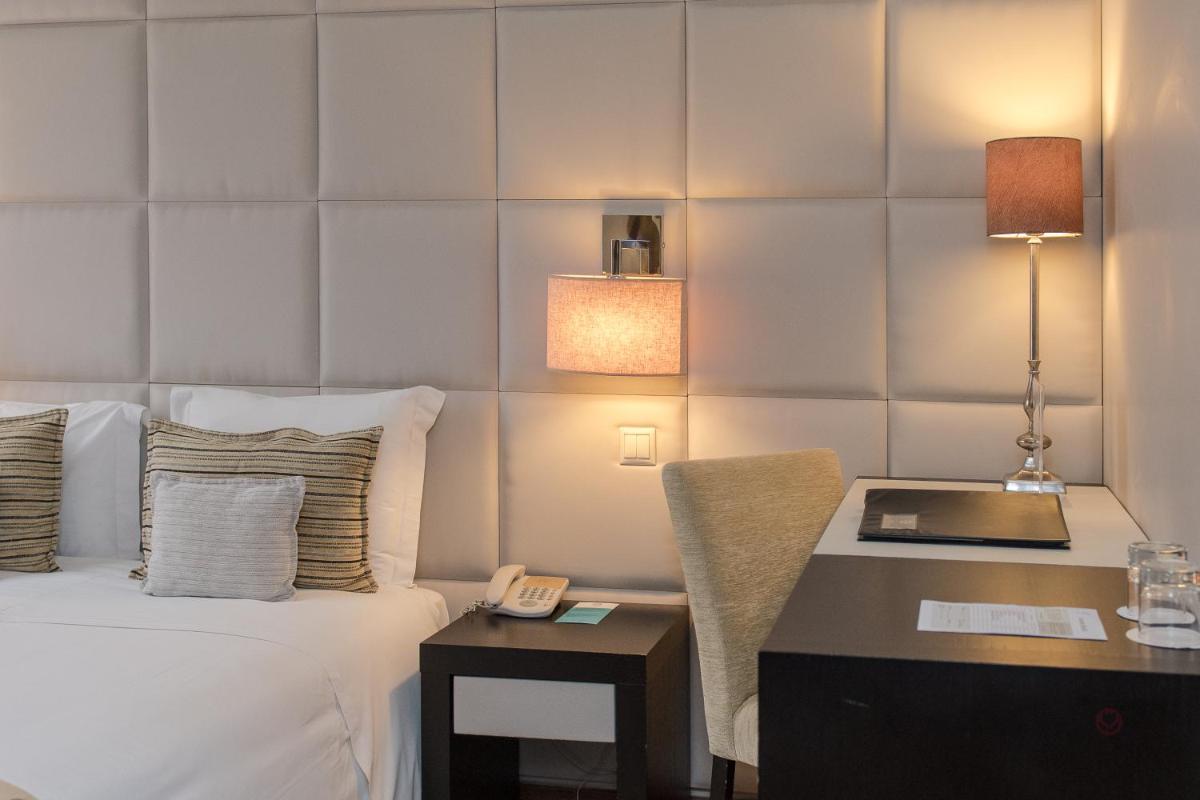 Uma cama ou camas num quarto em Your Hotel & Spa Alcobaça