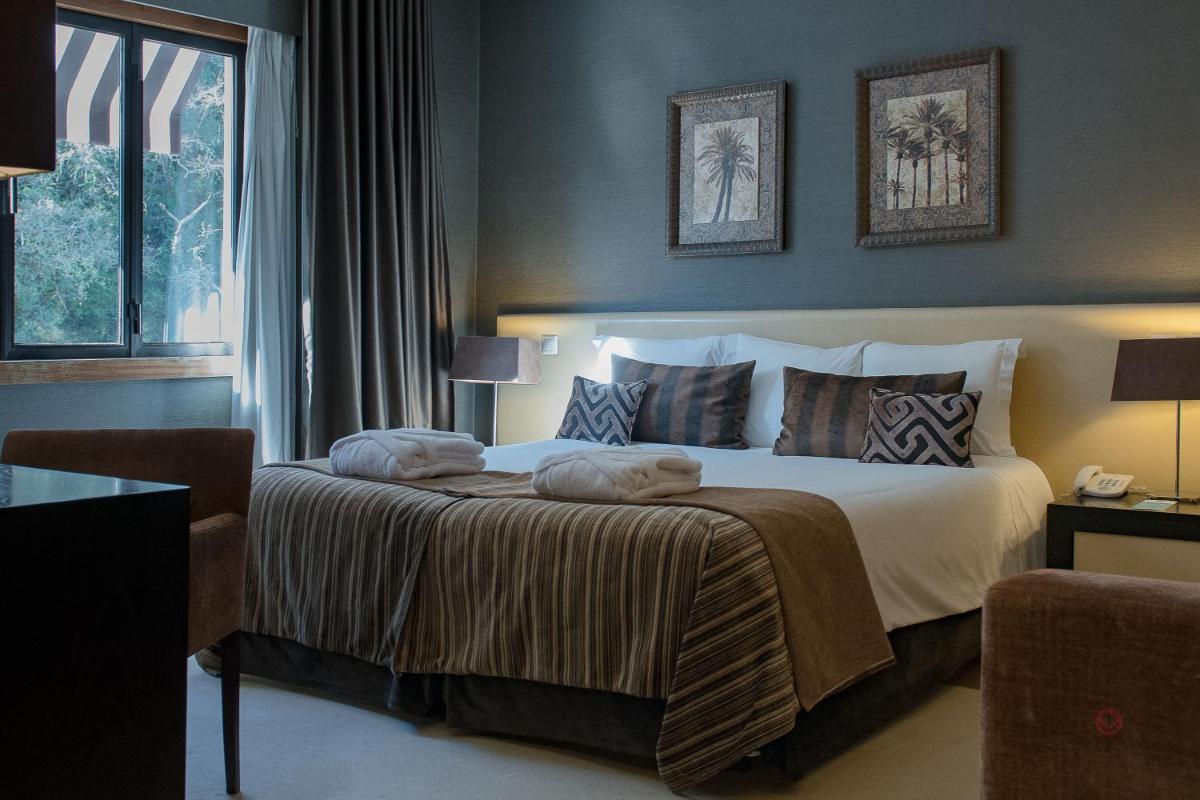 Uma cama ou camas num quarto em Your Hotel & Spa Alcobaça