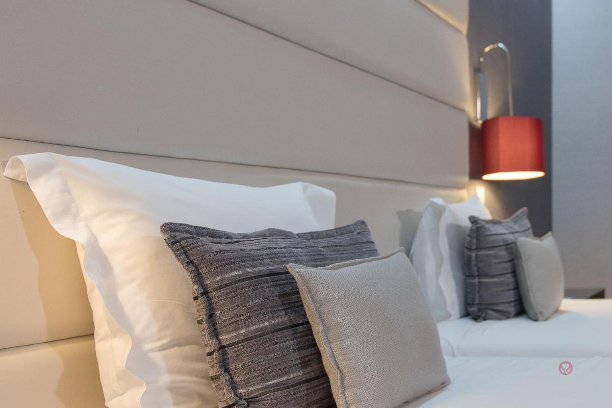 Uma cama ou camas num quarto em Your Hotel & Spa Alcobaça
