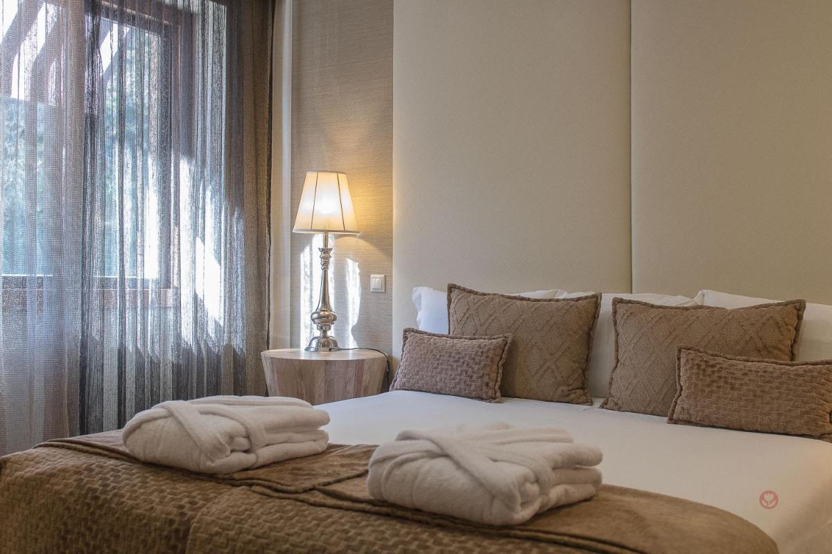 Uma cama ou camas num quarto em Your Hotel & Spa Alcobaça