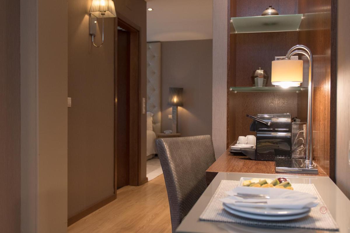 Uma área de estar em Your Hotel & Spa Alcobaça
