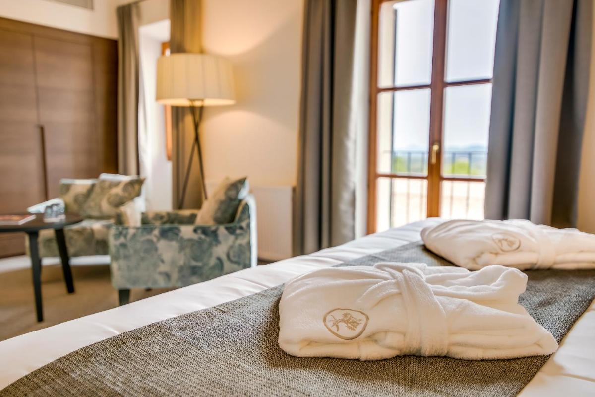 Cama o camas de una habitación en Carrossa Hotel & Spa