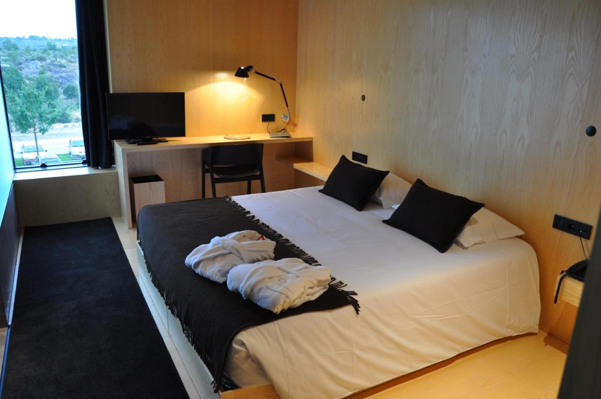 Uma cama ou camas num quarto em Cró Hotel Rural