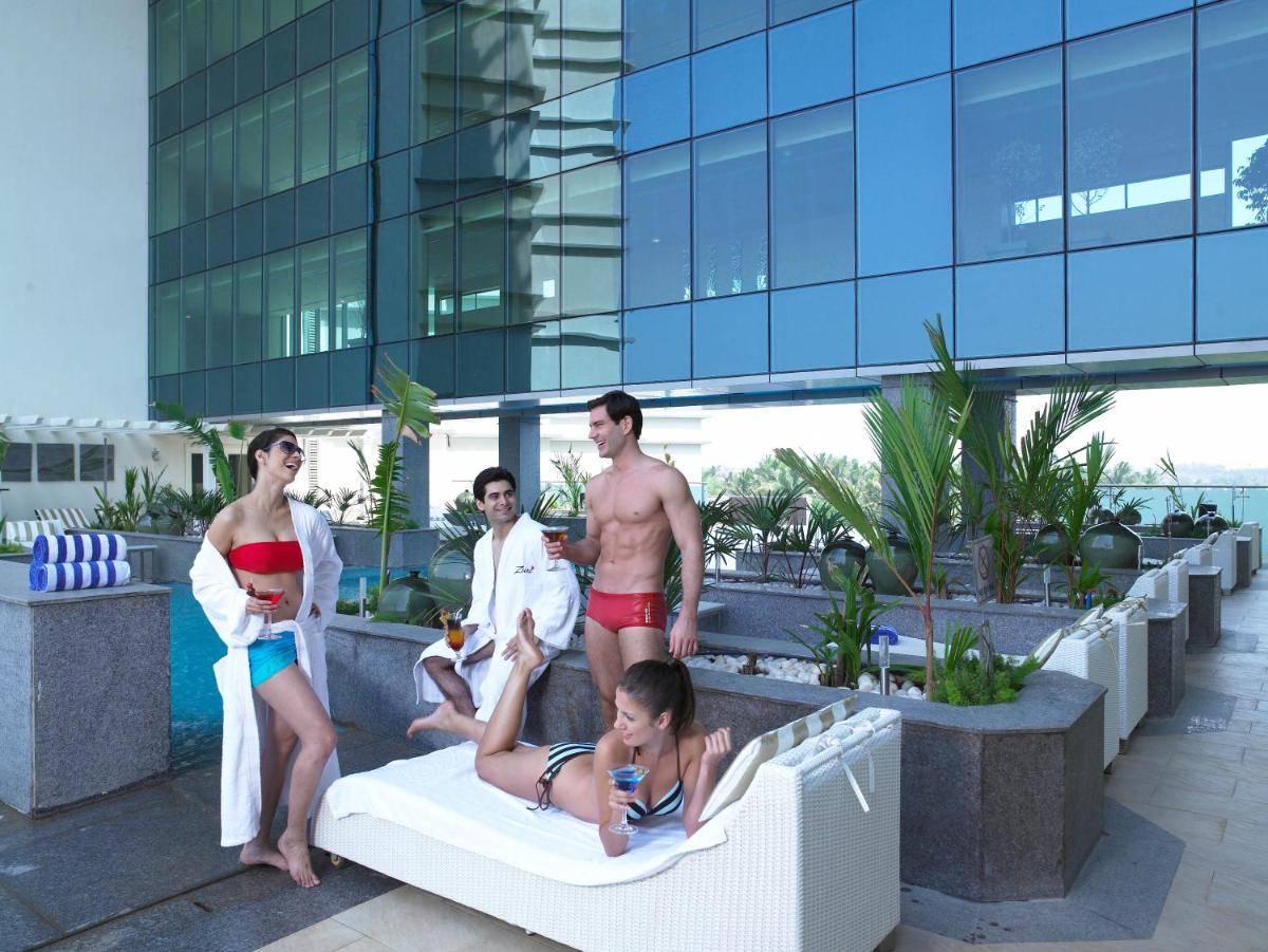 a group of people standing on the rooftop of a building at The Zuri Whitefield Bengaluru in Bengaluru