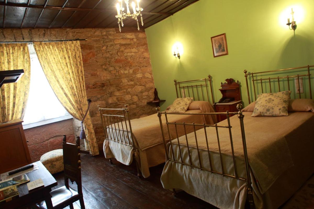 Cama o camas de una habitación en Hotel Monumento Pazo do Castro