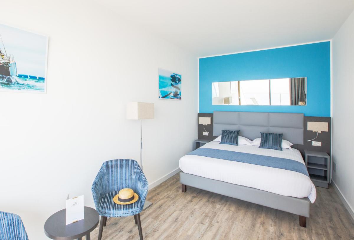 Un ou plusieurs lits dans un hébergement de l'établissement Les Terrasses d'Eze - Hôtel & Spa