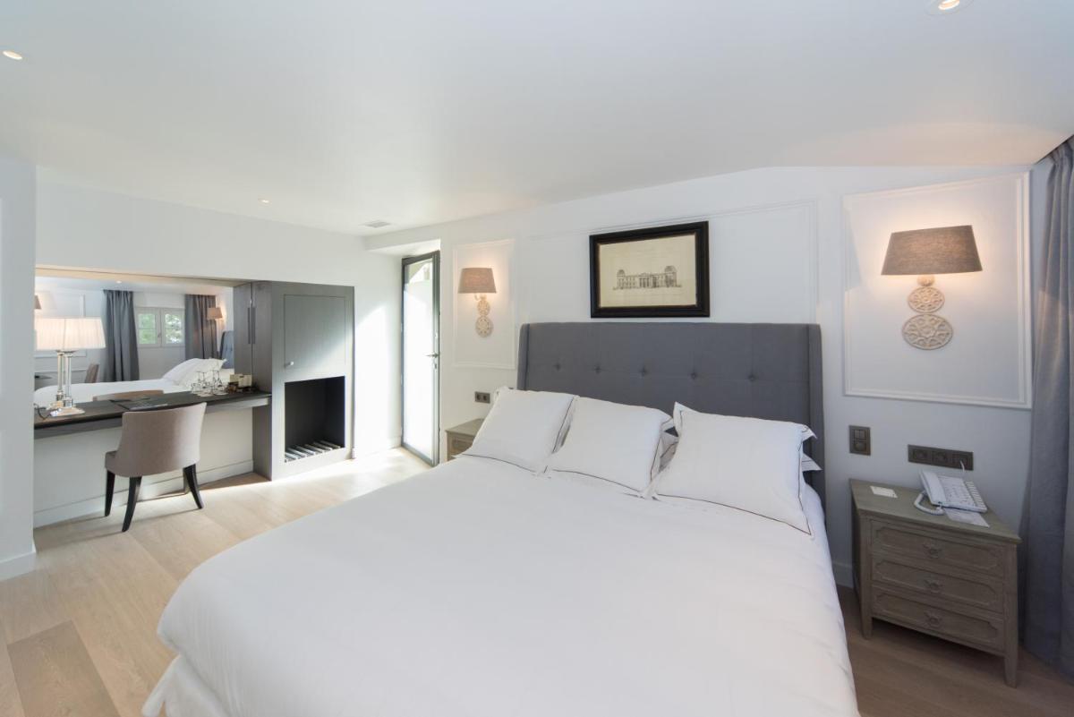 Un ou plusieurs lits dans un hébergement de l'établissement Hotel Les Bories & Spa