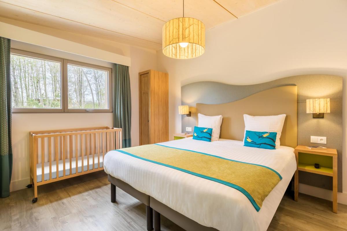 Cama o camas de una habitación en Center Parcs Villages Nature Paris