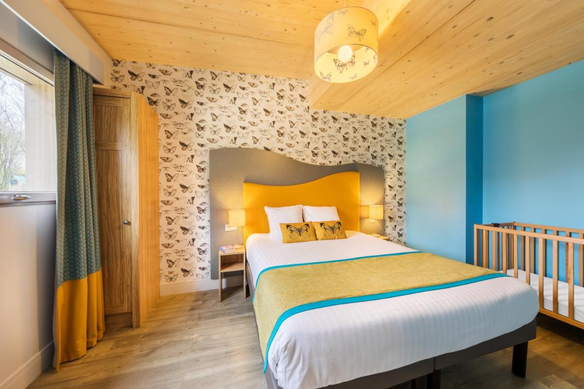 Cama o camas de una habitación en Center Parcs Villages Nature Paris