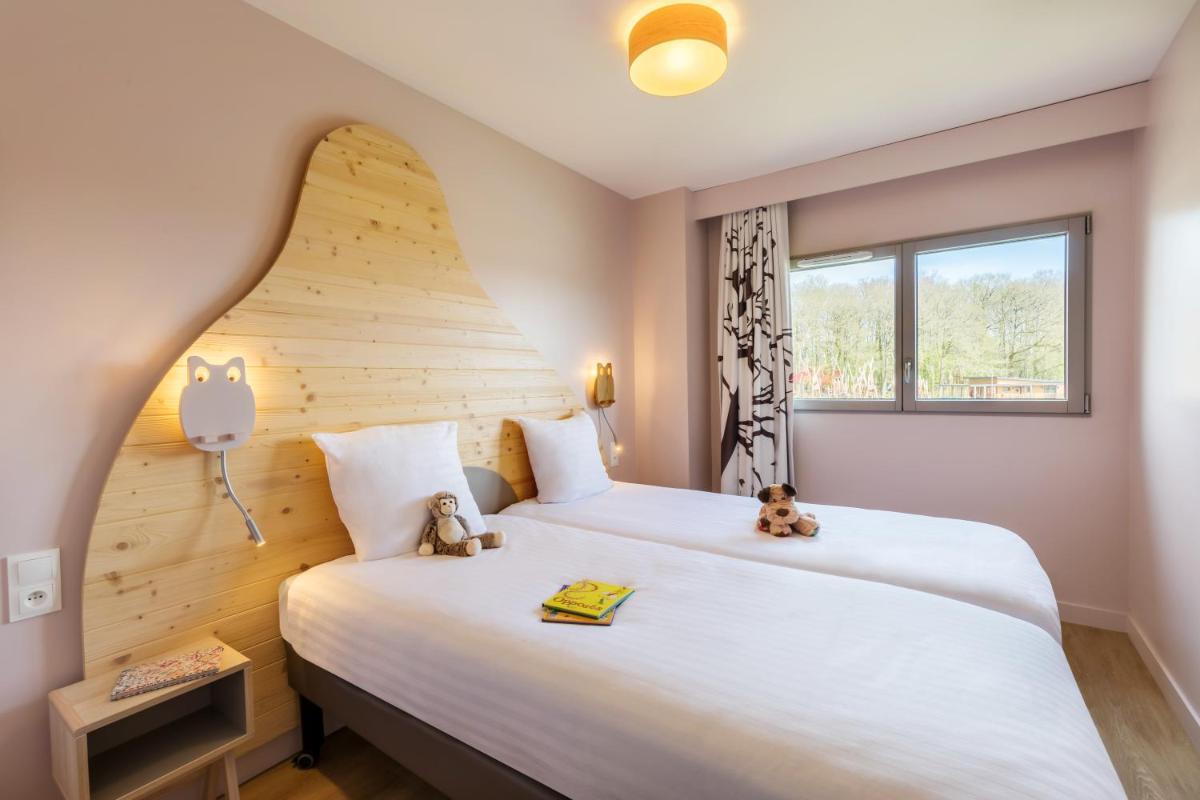 Cama o camas de una habitación en Center Parcs Villages Nature Paris