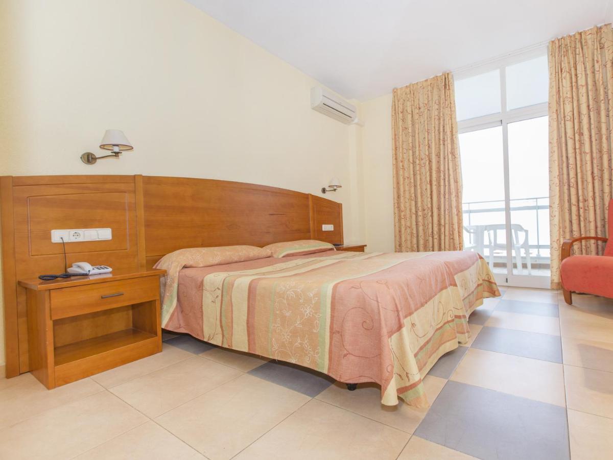 Cama o camas de una habitación en Hotel Tres Anclas