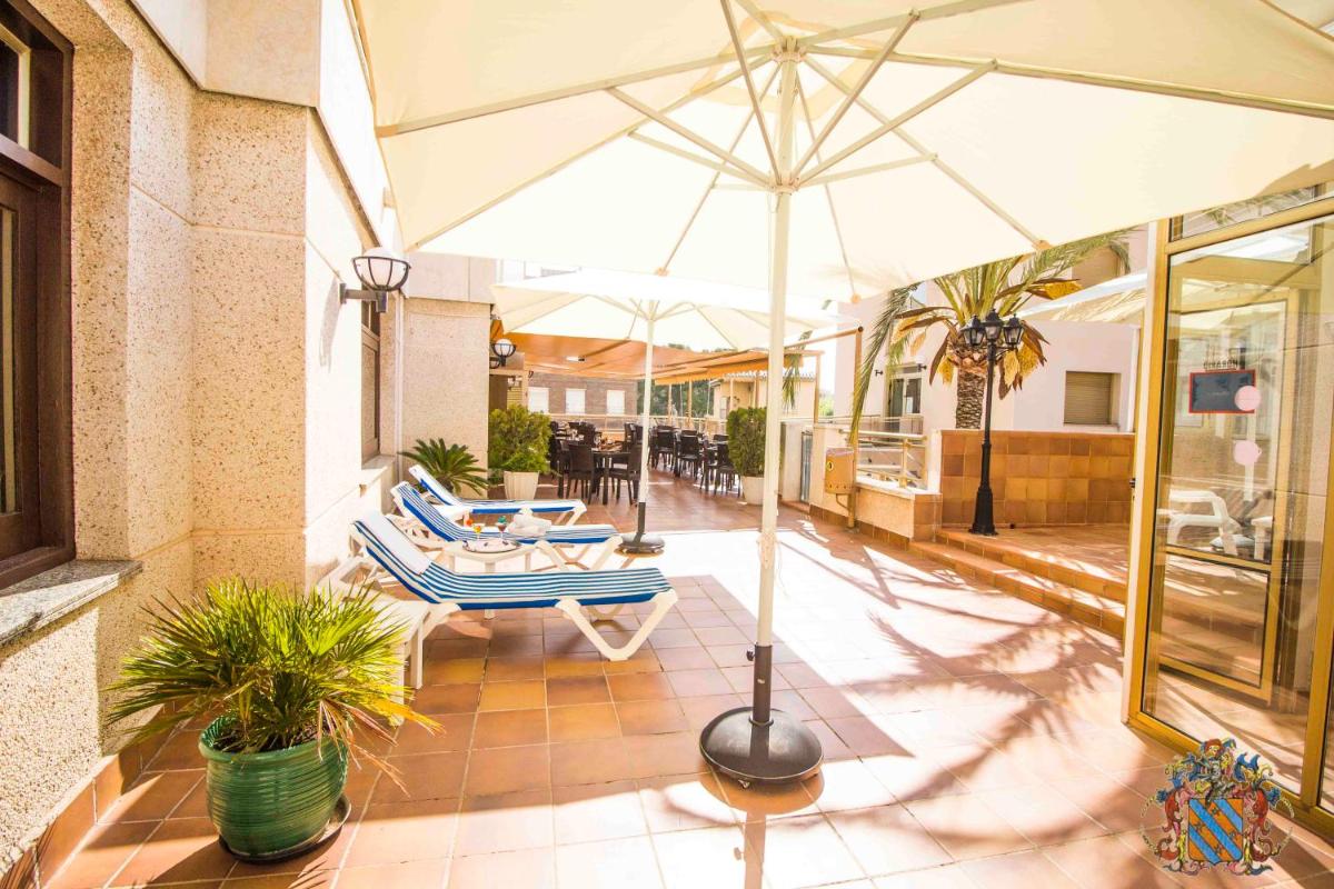 Un patio o zona al aire libre en Hotel Victoria Spa & Splay Center